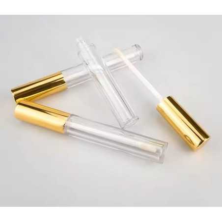 Tube de gloss et brillant à lèvres en plastique transparent avec applicateur intégré et capuchon métal doré - Fati Pack Emballag