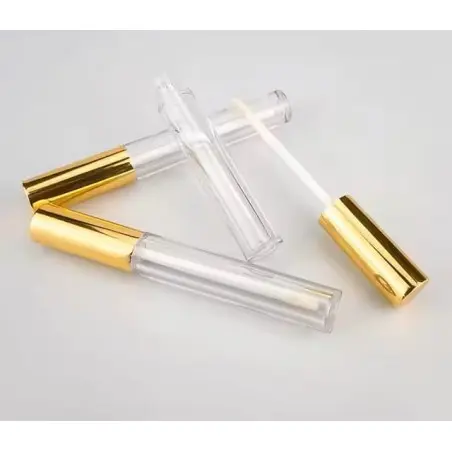Tube de gloss et brillant à lèvres en plastique transparent avec applicateur intégré et capuchon métal doré - Fati Pack Emballag