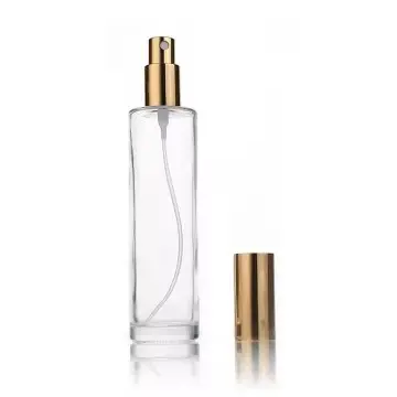 Flacon vaporisateur en verre transparent avec pompe spray dorée et bouchon métallique doré parfums, brumes ou soins cosmétiques