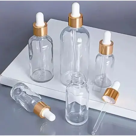 Flacons Cosmétiques Transparent avec Couvercle Doré et Pipette Blanche - Fatipack Group Emballage Maroc