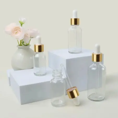 Flacons Cosmétiques Transparent avec Couvercle Doré et Pipette Blanche - Fatipack Group Emballage Maroc