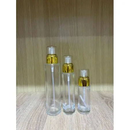 Flacon luxe en verre transparent avec pompe dorée pour cosmétiques - Fatipack Group Emballage Maroc