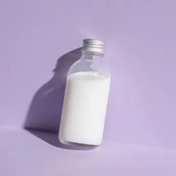 Flacon 100 ml en verre transparent avec bouchon à vis hermétique argenté - Fatipack Group Emballage Maroc