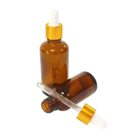 Flacon luxe en verre marron clair avec pipette blanche et finition cercle doré - Fatipack Group Emballage Maroc
