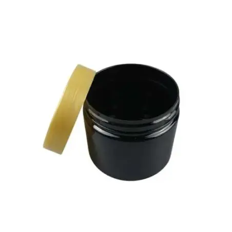 Pots d’emballage cosmétiques en plastique noir avec couvercle à vis doré hermétique - Fatipack Group Emballage Maroc