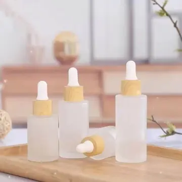 Flacon Laura en verre givrée avec compte gouttes et cercle en bambou pour l'emballage cosmétique - Fati Pack Packaging Maroc